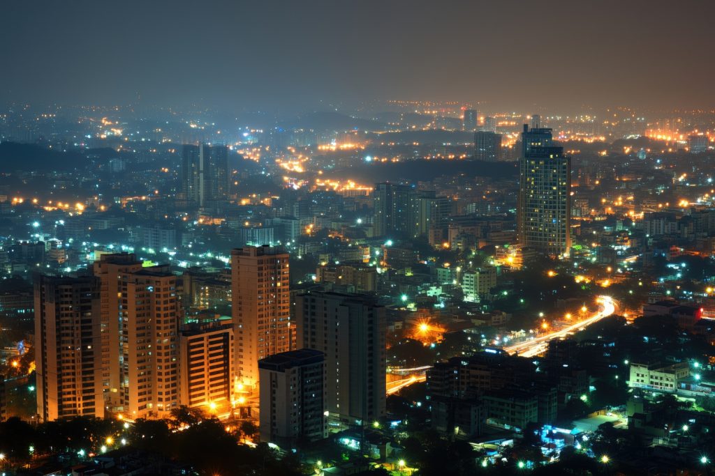 City skyline with glowing lights at dusk